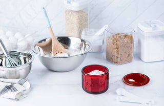 Baking ingredients and utensils on a white surface