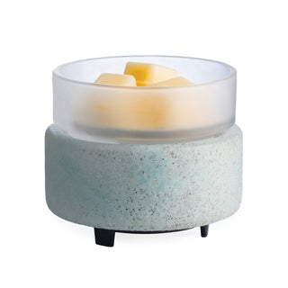 Ceramic wax warmer with glass lid on a white background