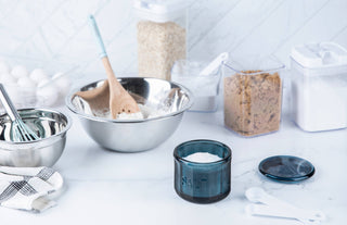 Baking ingredients and utensils on a white surface